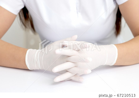 Hands of woman in medical gloves Hands of woman in medical gloves 67210513
