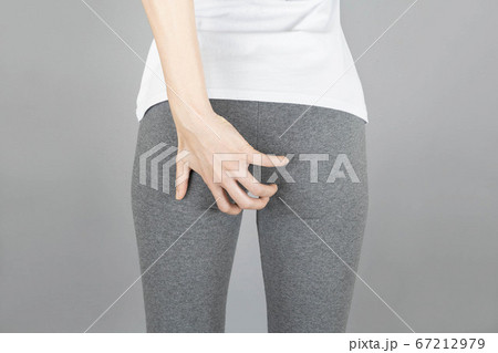 Hands holding bottom isolated on gray background,health care concept 67212979