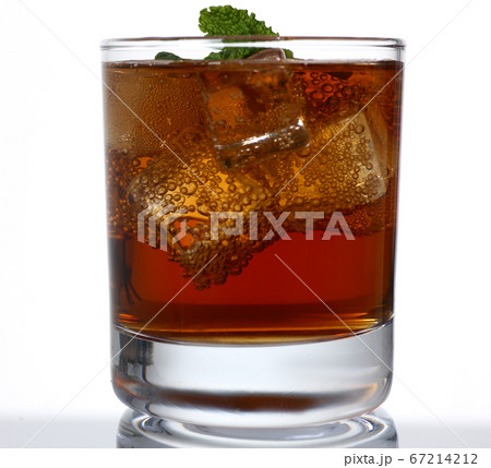 Glass of alcohol drink with ice in studio 67214212