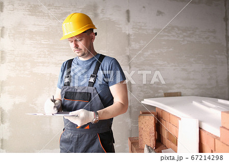 Engineer in work clothes and safety helmet 67214298