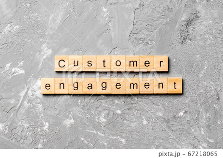 Customer engagement word written on wood block. Customer engagement word written on wood block. 67218065