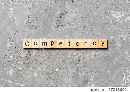 Competency word written on wood block. Competency 67218066