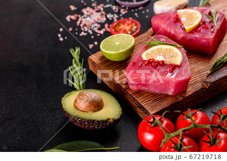 Fresh tuna fillet steaks with spices and herbs on 67219718
