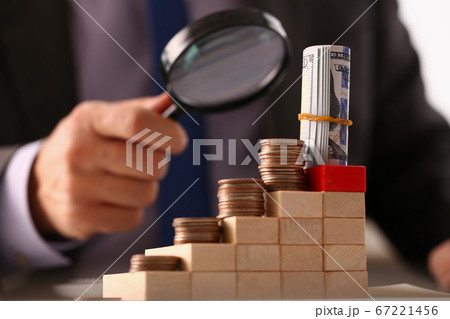 Boss sitting in the office and looking at money Boss sitting in the office and looking at money 67221456