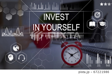 Invest In Yourself Phrase Over Background With Clock On Desk Invest In Yourself Phrase Over Background With Clock On Desk 67221986