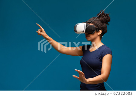 Young black girl wearing VR headset, innovative technologies Young black girl wearing VR headset, innovative technologies 67222002