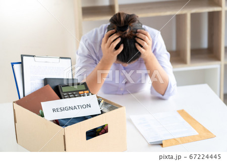 Businesswoman resigning from her job hold boxes Businesswoman resigning from her job hold boxes 67224445