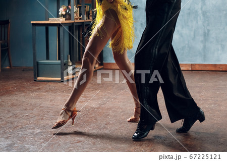 Ballroom dance samba. Close up of dancing legs of dancers. Ballroom dance samba. Close up of dancing legs of dancers. 67225121