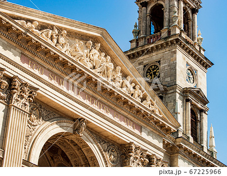 Fragment of facade of Saint Stephen Basilica, bell tower with a clock. St. Stephen Basilica - largest roman-catholic church in Budapest, Hungary. Fragment of facade of Saint Stephen Basilica, bell tower with a clock. St. Stephen Basilica - largest roman-catholic church in Budapest, Hungary. 67225966