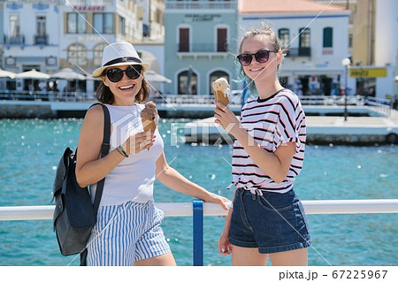 Europe tourist travel cruise vacation, mother and daughter with ice cream 67225967