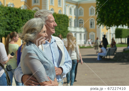 Beautiful happy mature couple traveling. Back view 67227410