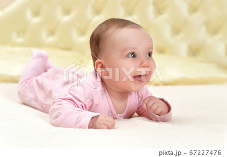 Portrait of cute little baby girl on bed Portrait of cute little baby girl on bed 67227476