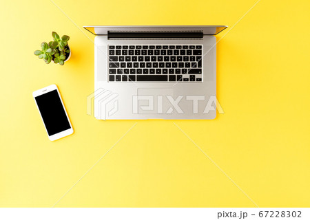 Modern workplace with laptop and mobile phone. Modern workplace with laptop and mobile phone. 67228302