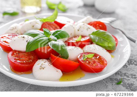 Caprese salad. Salad with mozzarella cheese fresh Caprese salad. Salad with mozzarella cheese fresh 67229366