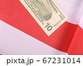 ten dollar bill in front of the American flag 67231014