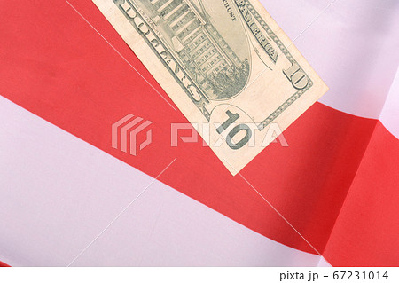 ten dollar bill in front of the American flag 67231014