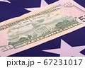 fifty dollar bill in front of the American flag 67231017