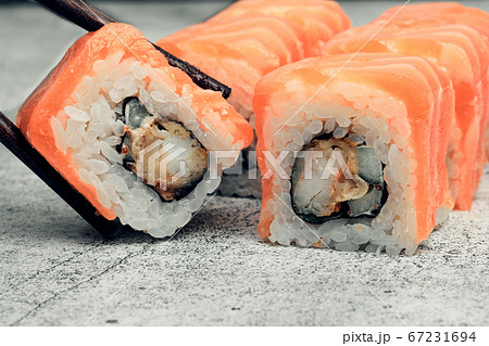 Traditional Japanese food, sushi and rolls. Ginger and wasabi, Chinese sticks. Rice and seafood food. Close up 67231694