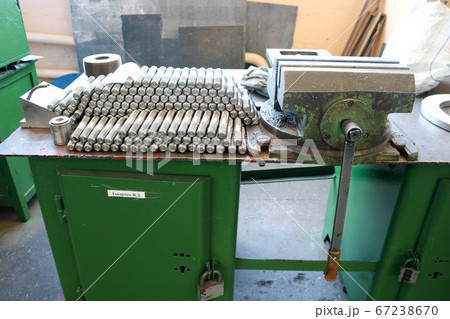 Many shiny metal studs with carving, nuts 67238670