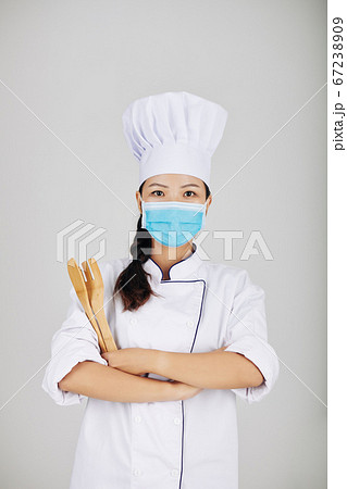 Chef with wooden fork and spatula Chef with wooden fork and spatula 67238909