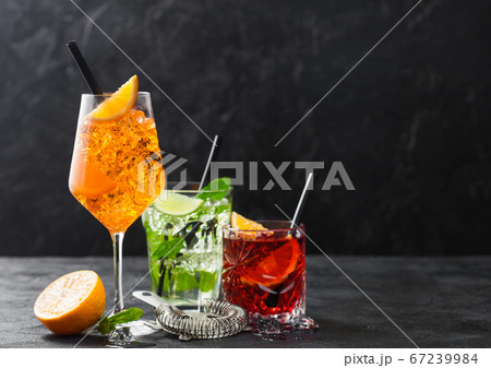 Glasses of spritz,mojito and negroni cocktails 67239984
