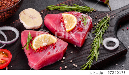Fresh tuna fillet steaks with spices and herbs Fresh tuna fillet steaks with spices and herbs 67240173