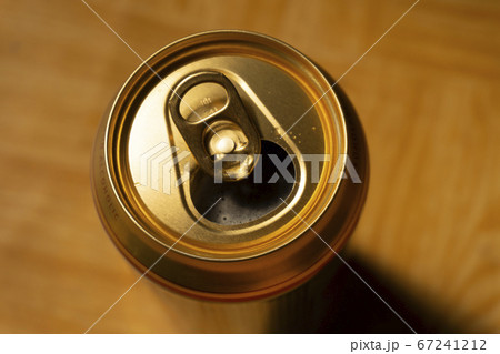 Opened can of beer viewed from above Opened can of beer viewed from above 67241212