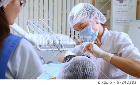 Young woman at dental clinic Young woman at dental clinic 67242383