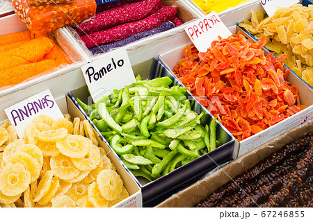 Colored sweet slices of candied fruit. Various dried fruits and eastern sweets on market. 67246855