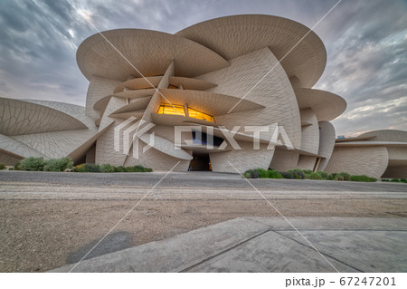 Doha, Qatar-November 16,2019 :National Museum of Qatar (Desert rose) panoramic  view at sunset 67247201