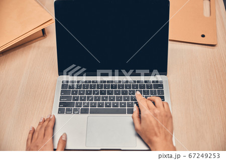 Female hands are working on modern laptop 67249253