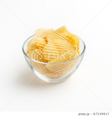 Crunchy potato snack. Chips in bowl isolated on white background Crunchy potato snack. Chips in bowl isolated on white background 67249917