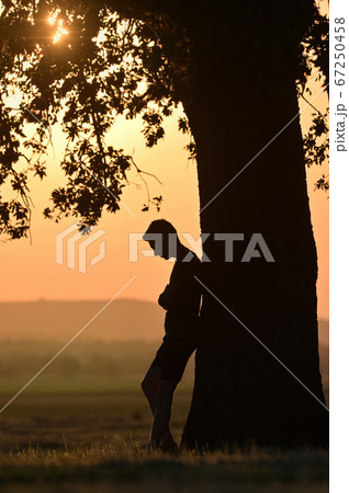 Portrait young man alone at sunset 67250458