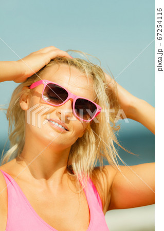 Young girl on beach. 67254116