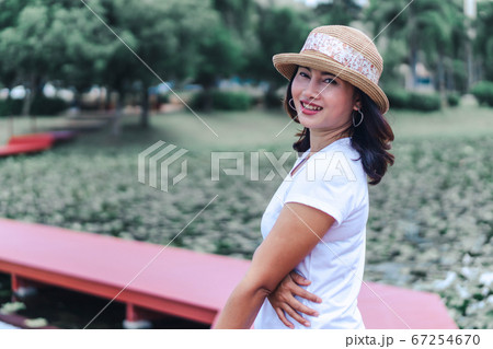 Woman happy feeling with green nature background 67254670