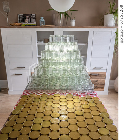 many glass jar empty glasses row for jam honey with lid caps abstract background bokeh 67255209