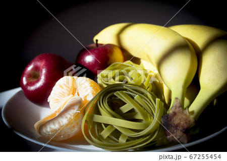 Bananas, apples, mandarin and uncooked spinach Bananas, apples, mandarin and uncooked spinach 67255454