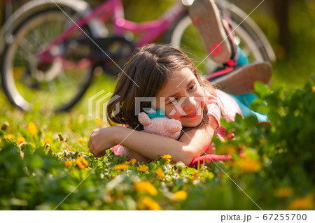 The cute little girl dreams of a wonderful future The cute little girl dreams of a wonderful future 67255700