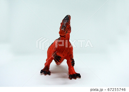 2 leg toys dinosaur in red color and made of plastic isolated in white background. 2 leg toys dinosaur in red color and made of plastic isolated in white background. 67255746