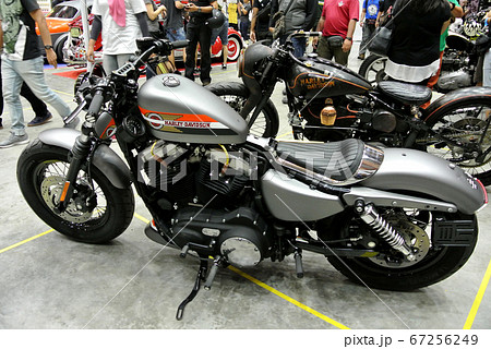 KUALA LUMPUR, MALAYSIA -JULY 29, 2017: Design of Harley-Davidson motorcycle brand and logos printed on the motorcycle body. Some of the logos were costume made by the owner. KUALA LUMPUR, MALAYSIA -JULY 29, 2017: Design of Harley-Davidson motorcycle brand and logos printed on the motorcycle body. Some of the logos were costume made by the owner. 67256249