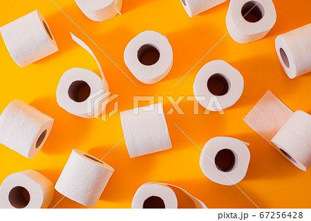 Top view of toilet paper rolls on the yellow Top view of toilet paper rolls on the yellow 67256428
