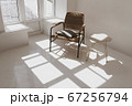 Empty white sunny room with wicker chair and table. Minimalist design 67256794