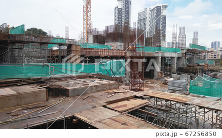 KUALA LUMPUR, MALAYSIA -AUGUST 25, 2017: Construction site in progress during daytime. Construction of the structure of the building is on-going. KUALA LUMPUR, MALAYSIA -AUGUST 25, 2017: Construction site in progress during daytime. Construction of the structure of the building is on-going. 67256850
