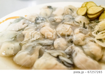 fresh oysters close-up on white plate fresh oysters close-up on white plate 67257265