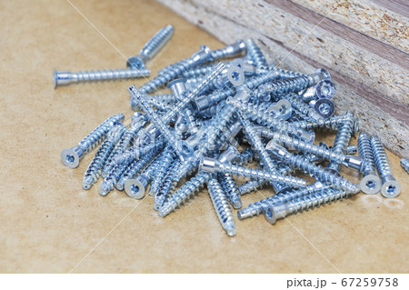 Screw-on for furniture. Metal screw. Vertical. Metal screws. Furniture fittings and fittings. Stainless steel. Realistic. Screw-on for furniture. Metal screw. Vertical. Metal screws. Furniture fittings and fittings. Stainless steel. Realistic. 67259758