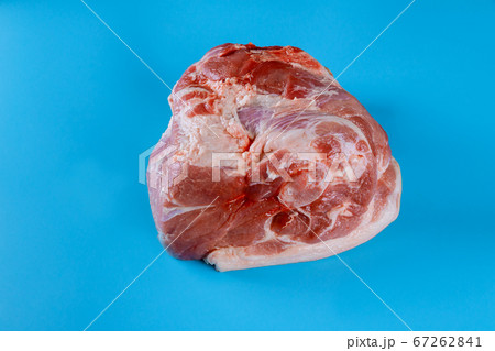 Raw pork leg isolated on blue background Raw pork leg isolated on blue background 67262841