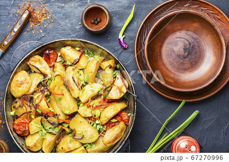 Roasted potato in a frying pan 67270996