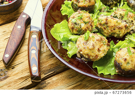 Mushrooms stuffed with meat. 67273656