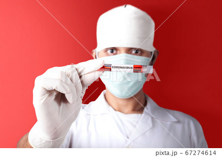 Asian doctor man in flu mask and protective gloves 67274614