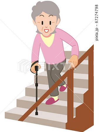 Senior woman walking down the stairs with a cane - Stock